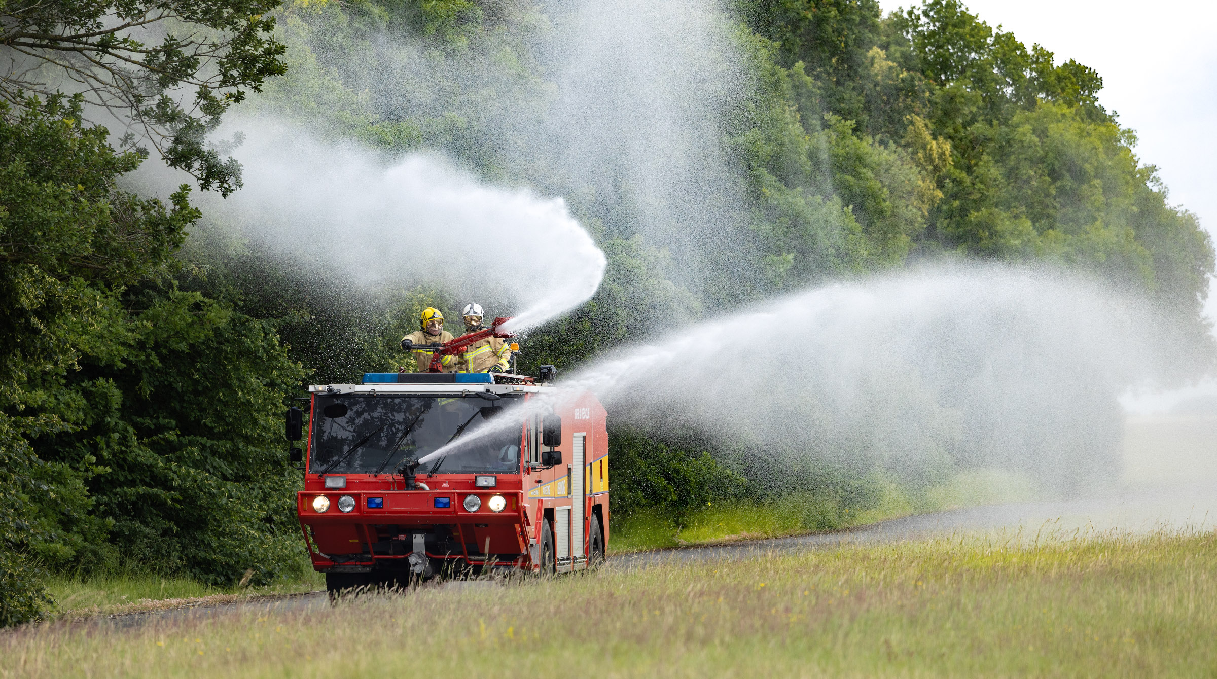 Firefighters operating the specialised fire engine